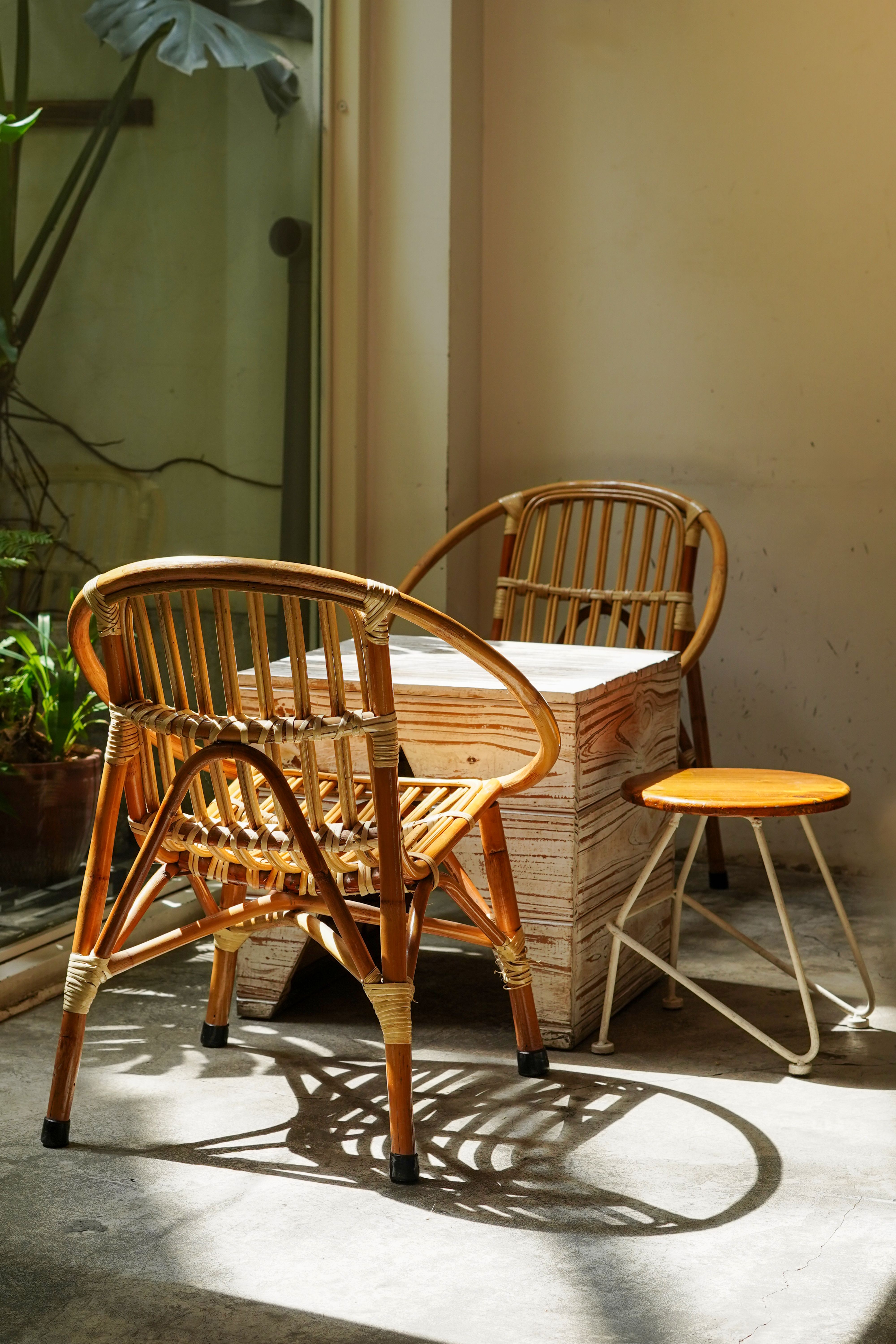 An Upaskar bamboo decorative room set — a floor lamp, two side tables, a decorative tray, and a magazine rack in matching natural bamboo finish arranged in a styled living room